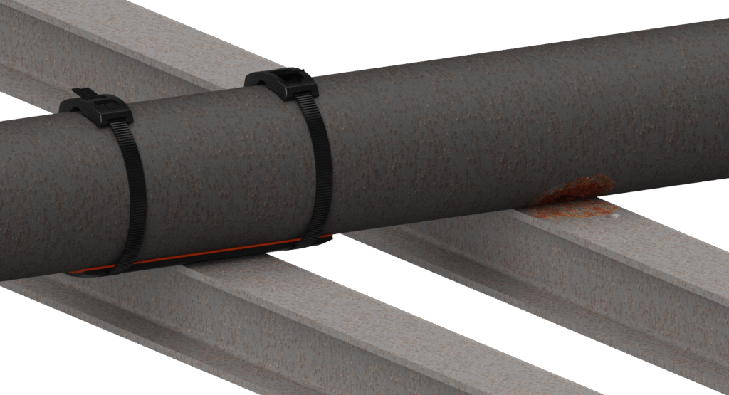 Pipe on steel beams with a RedLineIPS SmartPad strapped by two black composite bands; nearby support shows orange-brown corrosion buildup.
